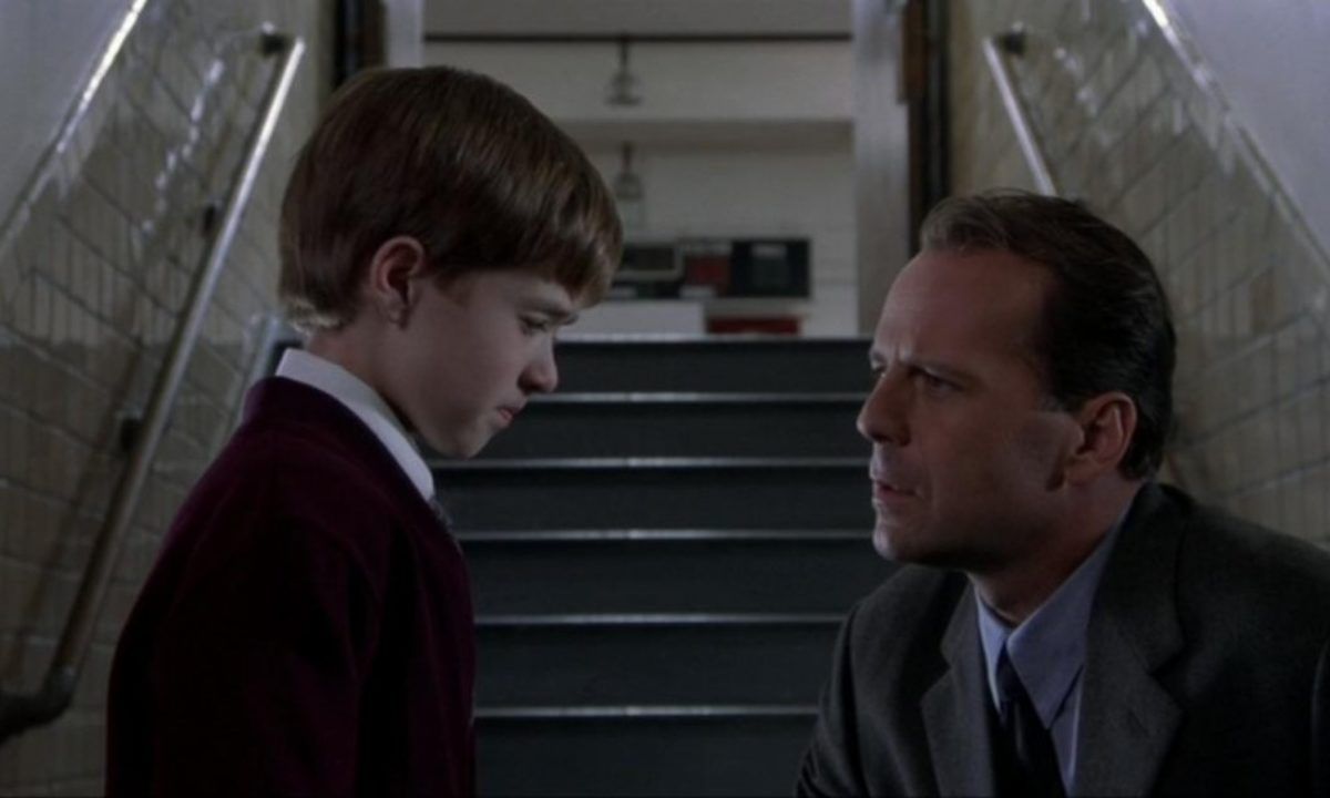 Bruce Willis looks at Haley Joel Osment in The Sixth Sense.