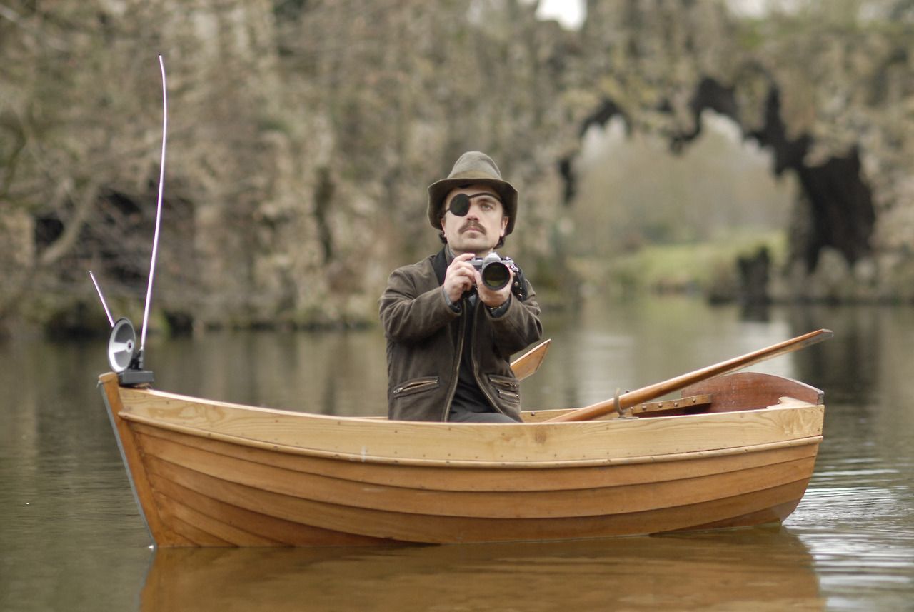 Peter Dinklage takes photos from a canoe in Penelope