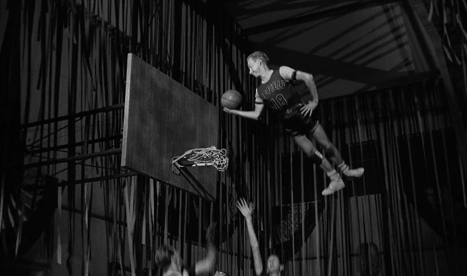 A man plays gravity-defying basketball in The Absent Minded Professor
