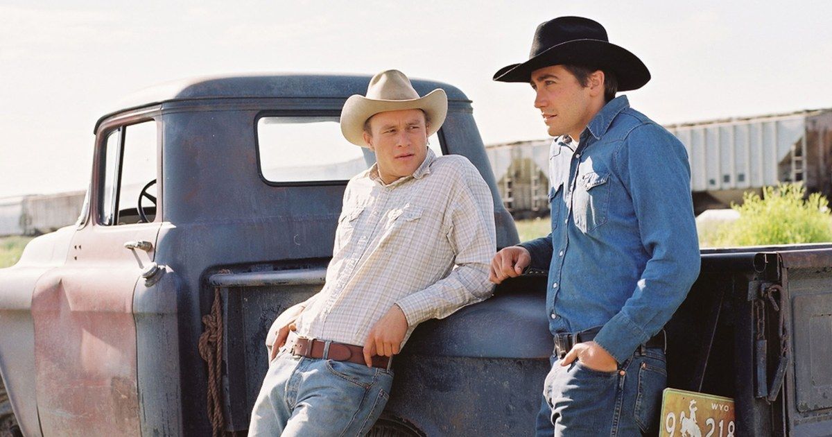 Jake Gyllenhaal and Heath Ledger recline on a truck