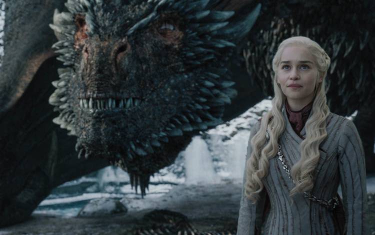 Daenerys stands with her dragon, Drogon.