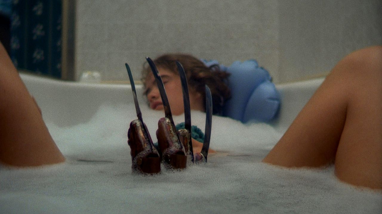Freddy's claw comes out of Heather Langenkamp's bathwater in A Nightmare on Elm Street