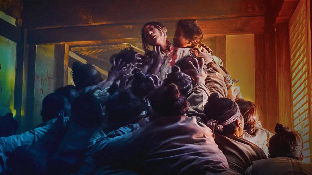 Zombie pile crawls upward on a woman in All of Us Are Dead