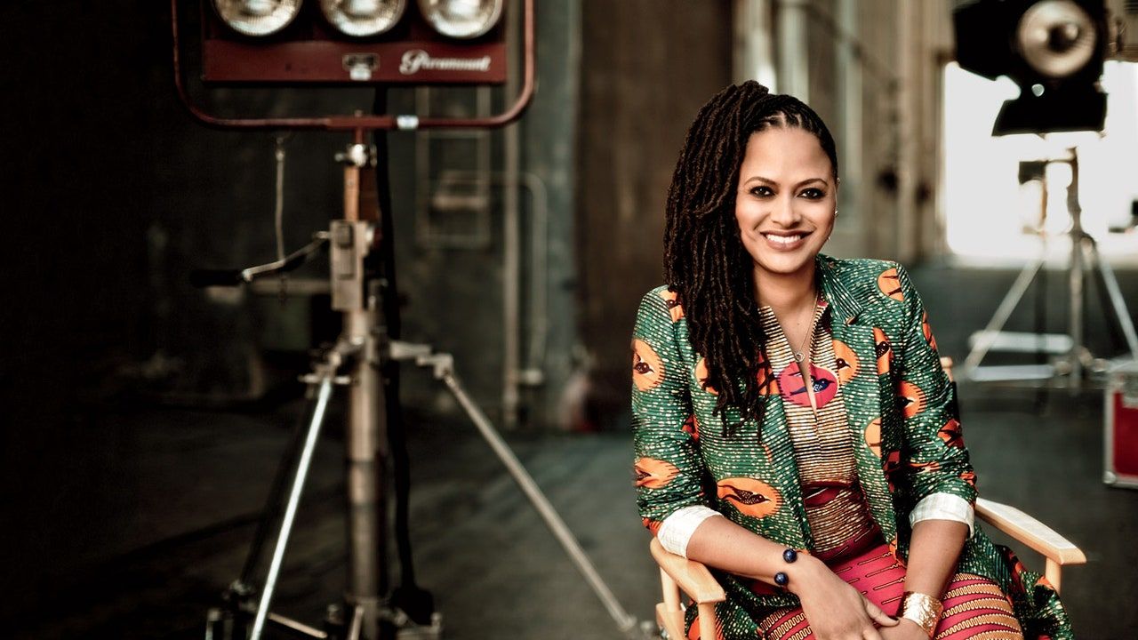 Ava DuVernay sits in a film studio