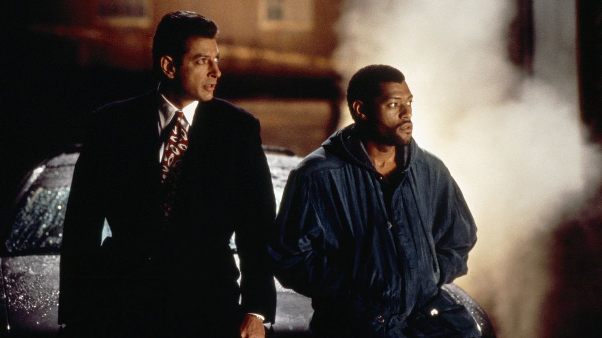 Jeff Goldblum and Laurence Fishburne lean on a steaming car in Deep Cover
