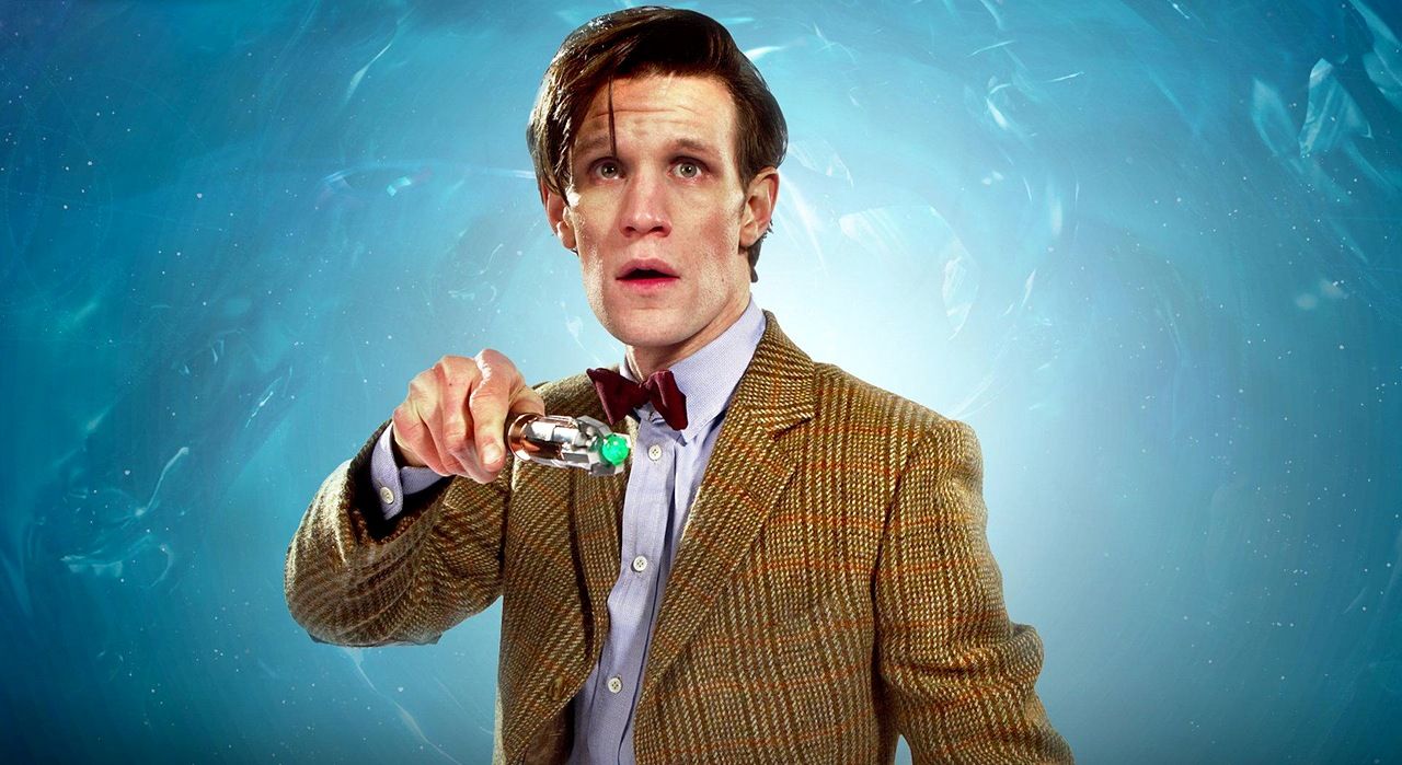 Doctor Who's Matt Smith looks upward against a swirling blue background
