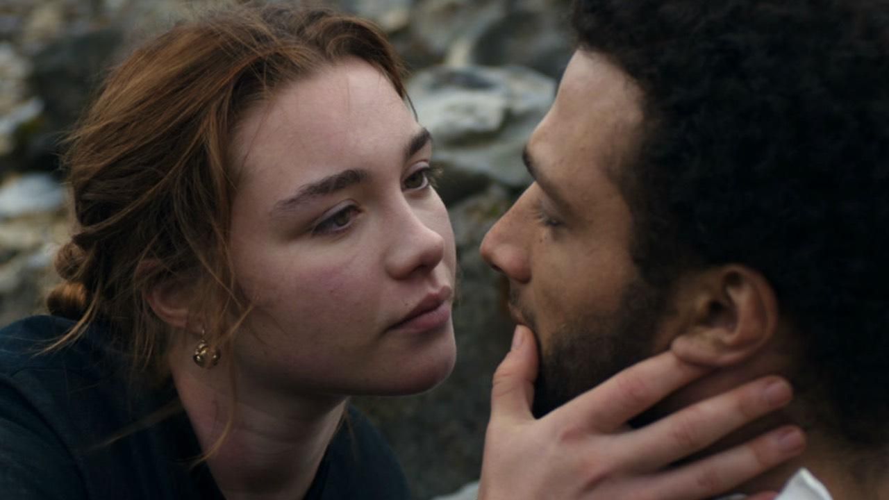 Florence Pugh holds a man's head in Don't Worry Darling