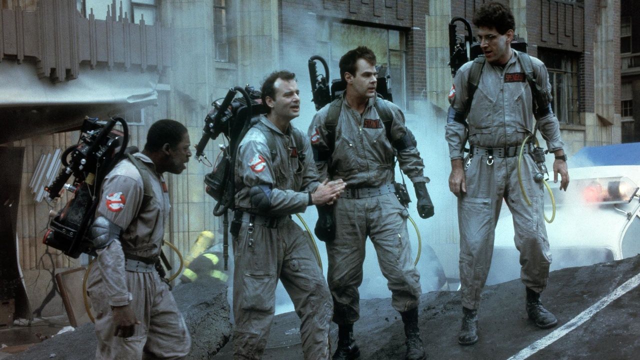 The cast of Ghostbusters are suited up 