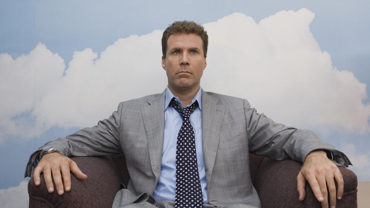 Will Ferrell sits in a chair in Stranger Than Fiction