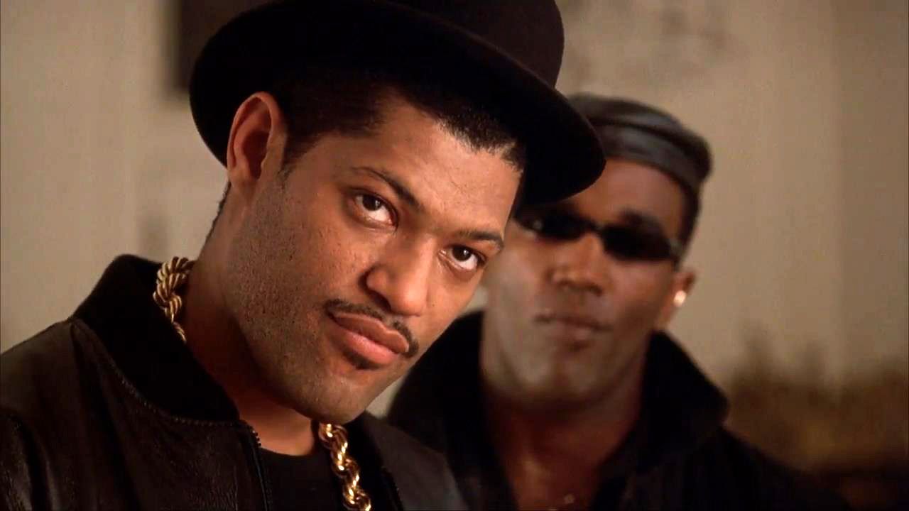 Laurence Fishburne wear his hat and gold chain in The King of New York