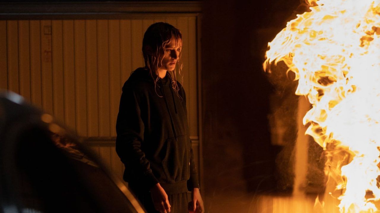 Agathe Rousselle stares at fire