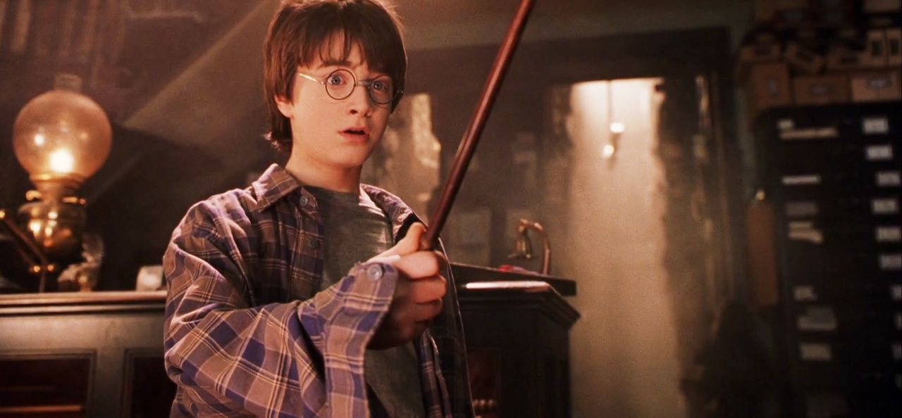 Harry Potter holding a wand.