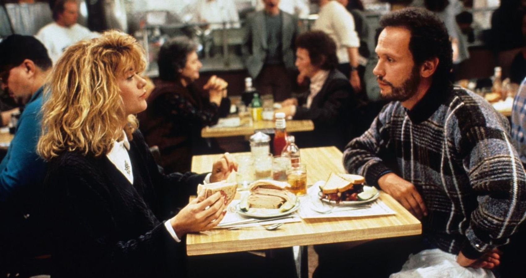 Meg Ryan and Billy Crystal sitting in a diner