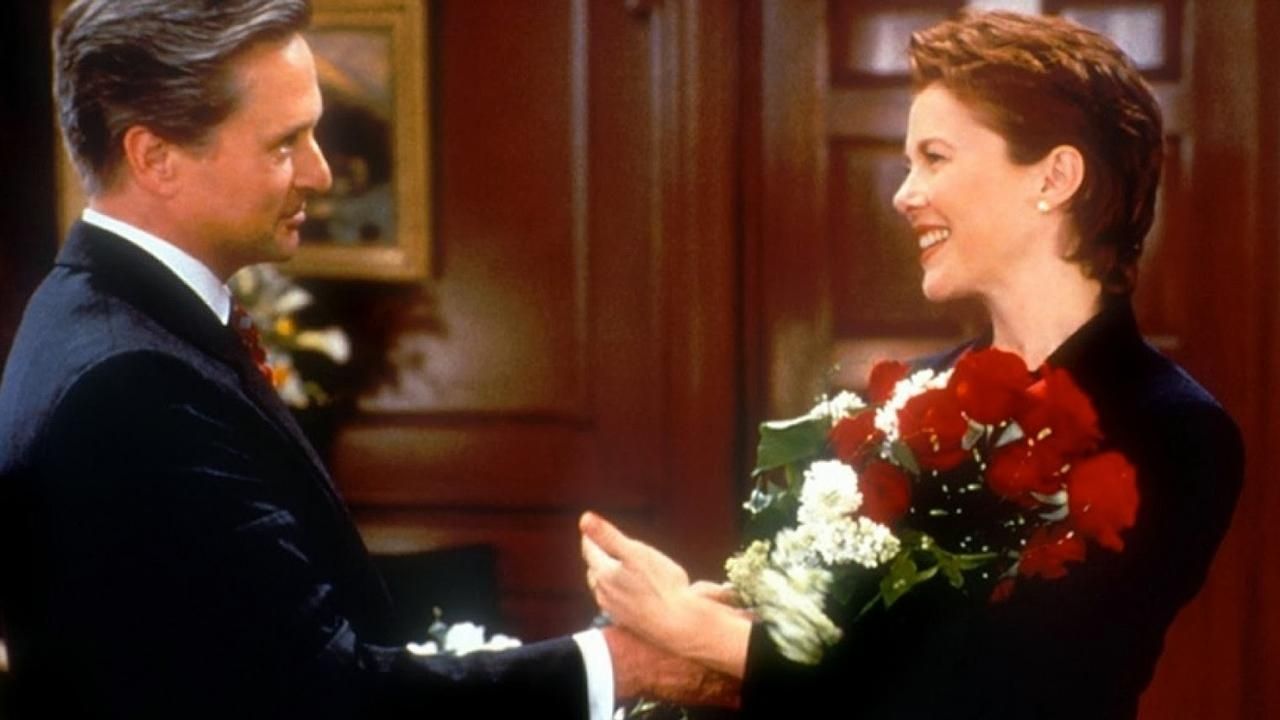 Michael Douglas giving Annette Bening flowers in The American President. 