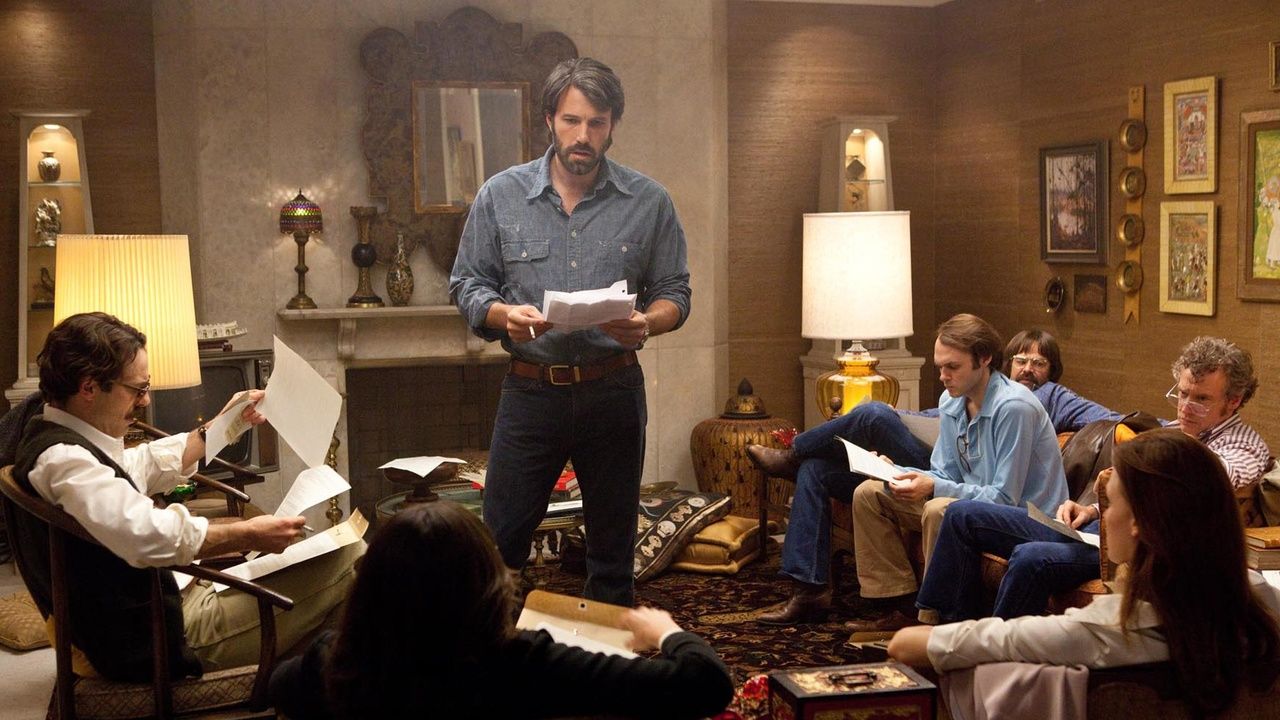Ben Affleck holding a script in Argo. 