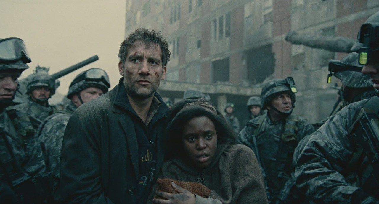 Clive Owen walks with the military in “Children of Men.” 