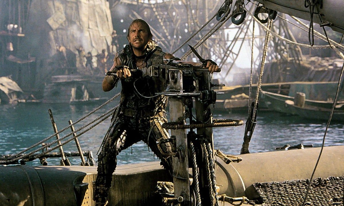 Kevin Costner tries to steer a boat in the post-apocalypse