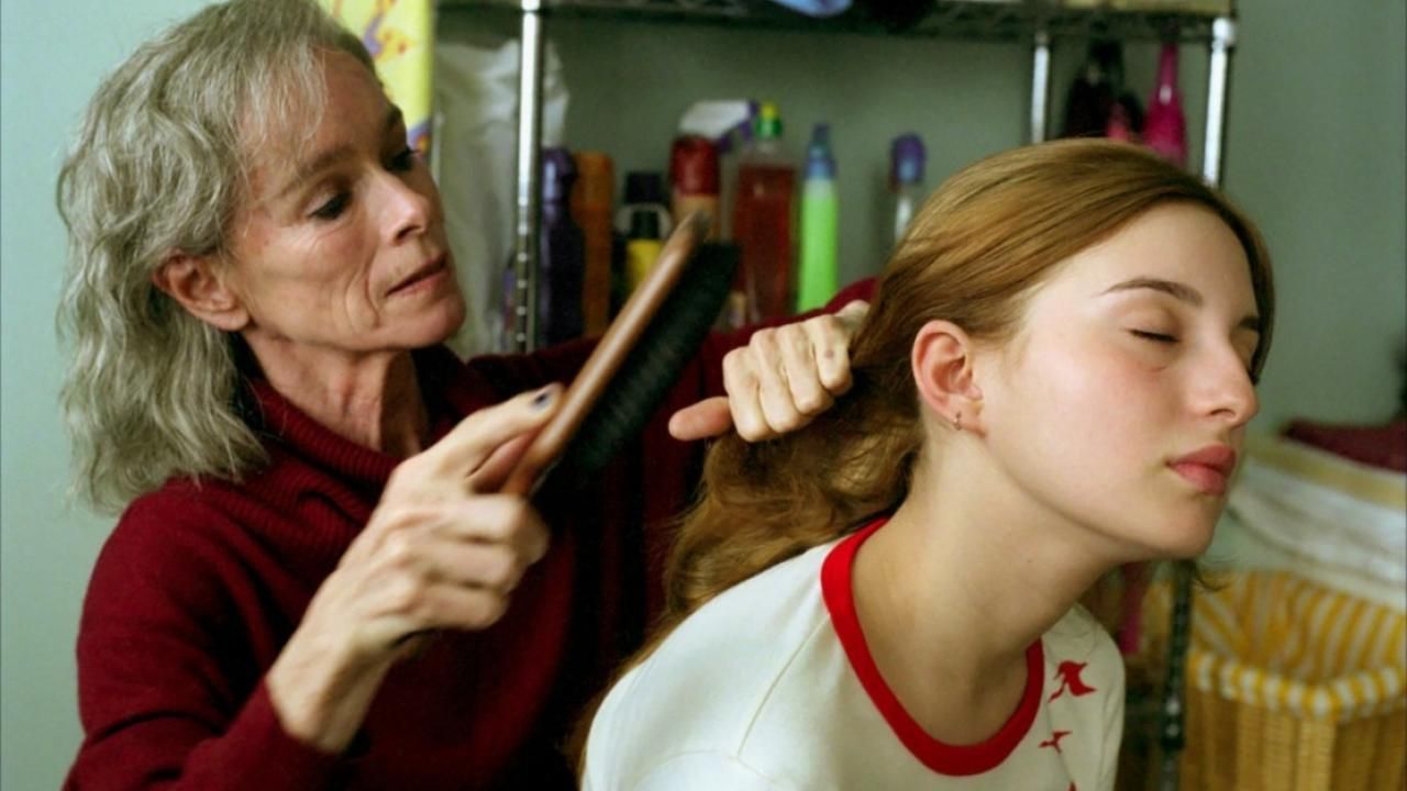 A woman brushing hair in Melissa P. 