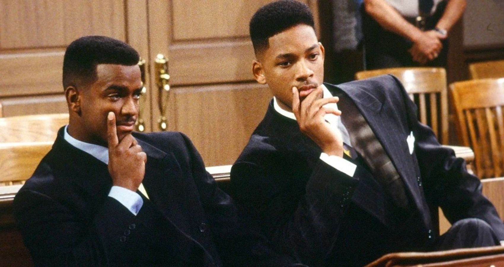 Will and Carlton have their hands to their face, thinking in their nice suits in court, in Fresh Prince of Bel Air
