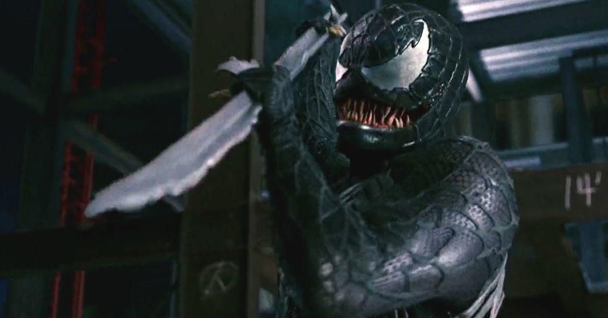 Venom ready to stab something off camera with a long jagged pole.
