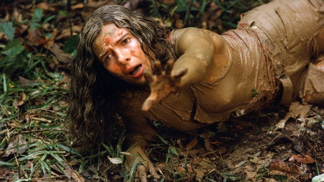 Woman on the ground in Cannibal ferox. 
