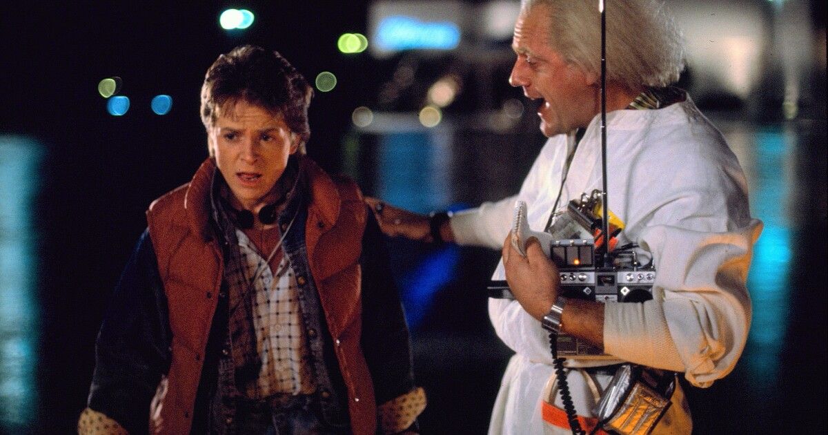 Michael Fox and Christopher Lloyd at night in the street in Back to the Future