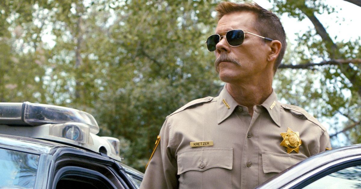 Kevin Bacon with a moustache in police uniform in Cop Car