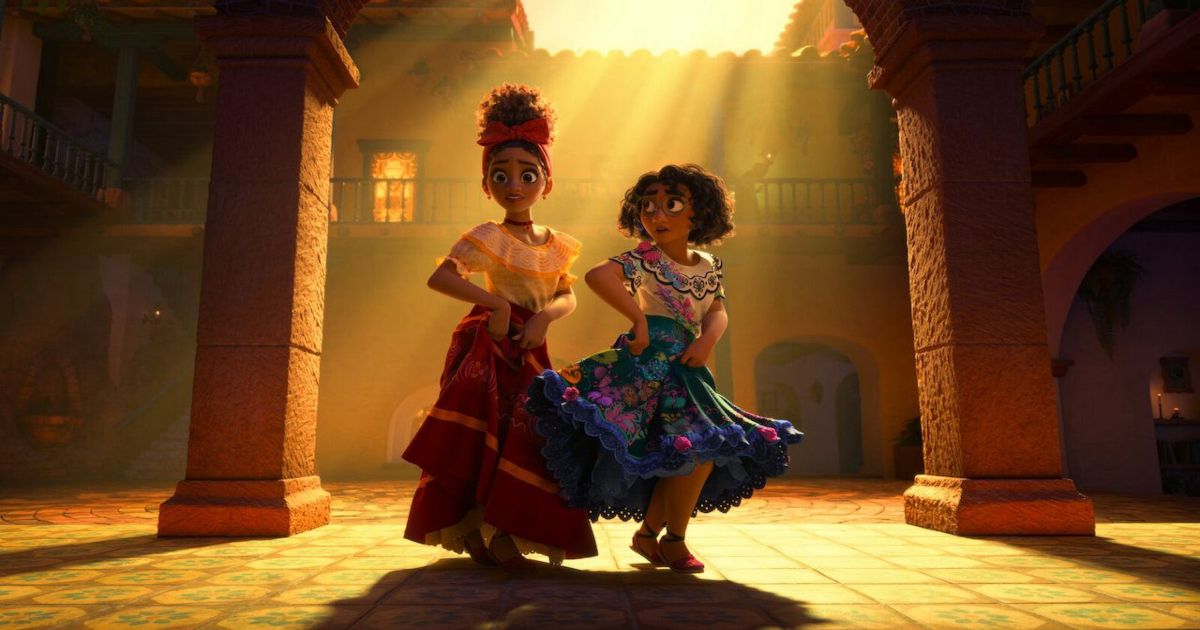 Two women dance in a sunlight corridor in Encanto