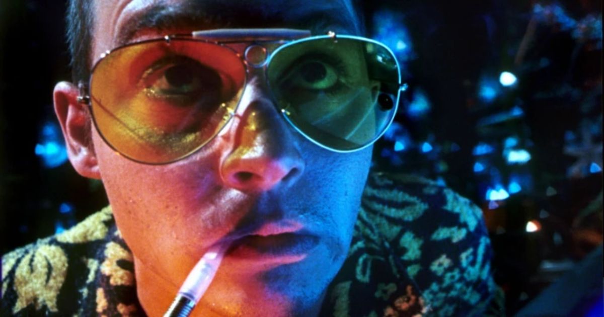 Johnny Depp smokes and looks up in Fear and Loathing in Las Vegas