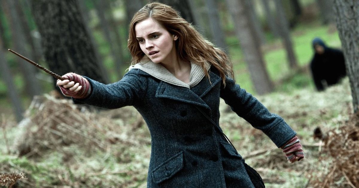 Hermione in Harry Potter casting a spell with her wand in the woods