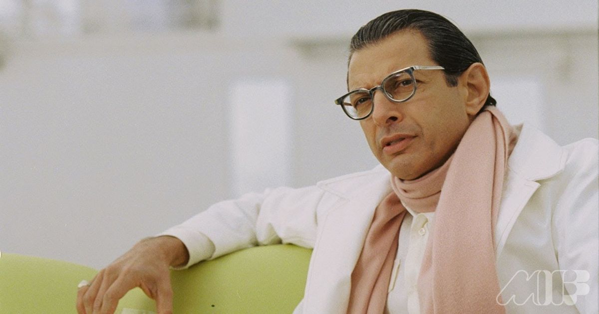 Jeff Goldblum slicked back hair on a couch in Life Aquatic