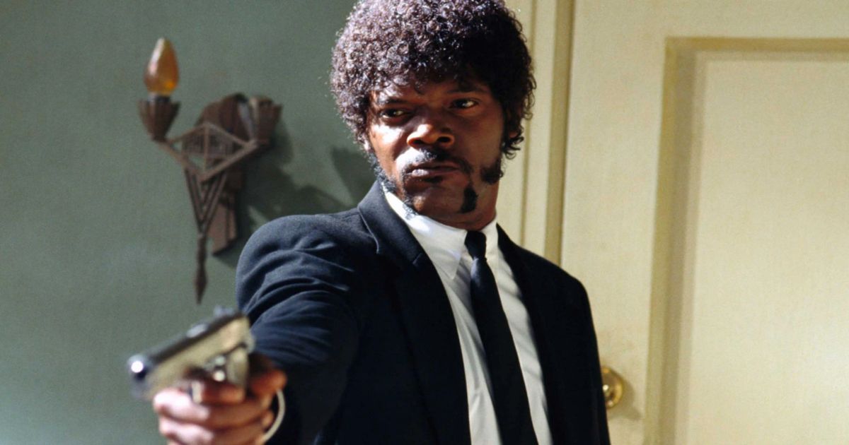 Samuel L. Jackson in a suit pointing a gun in Pulp Fiction