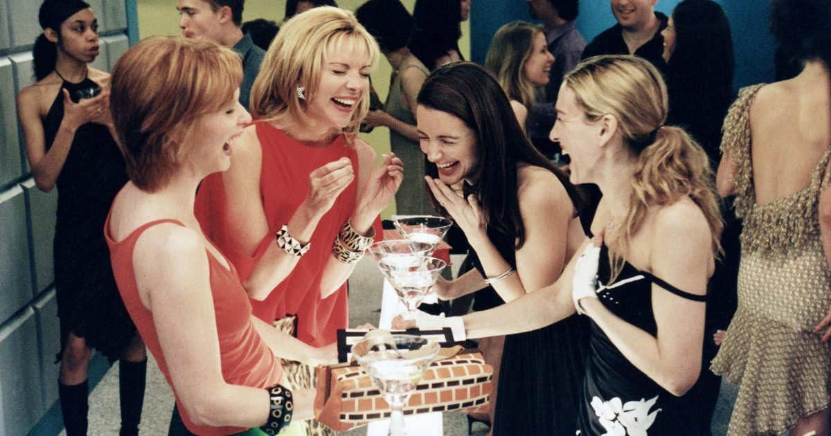 The girls of Sex and the City laughing at a party