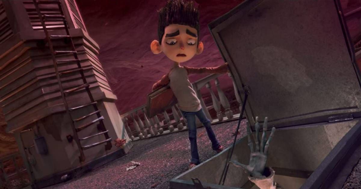 Norman, voiced by Kodi Smit-McPhee, stands looking at a skeleton during a scene from the animated film ParaNorman (2012).
