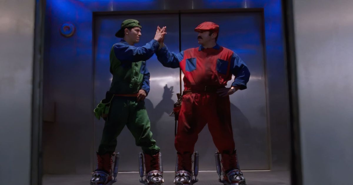 Super Mario Bros. hi-five in front of an elevator