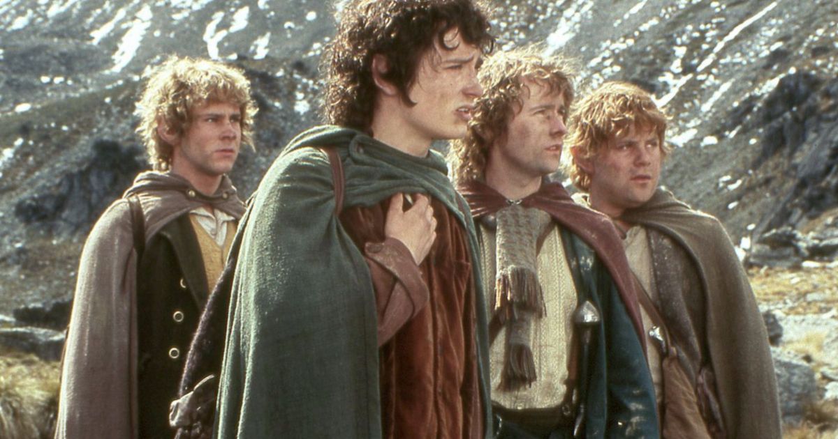 The group of hobbits walk through the mountains in The Lord of the Rings Return of the King