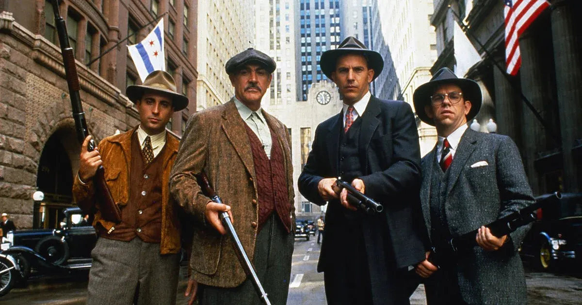 The cast of The Untouchables holding guns