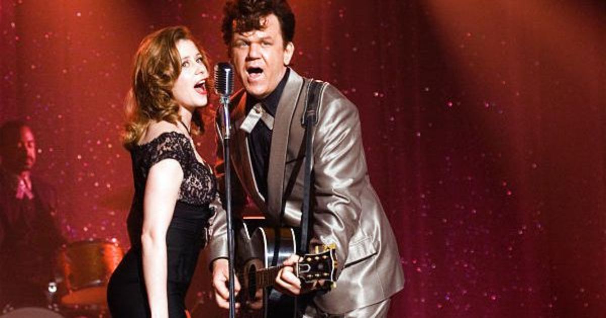 Reilly sings on stage with Amy Adams in Walk Hard Dewey Cox
