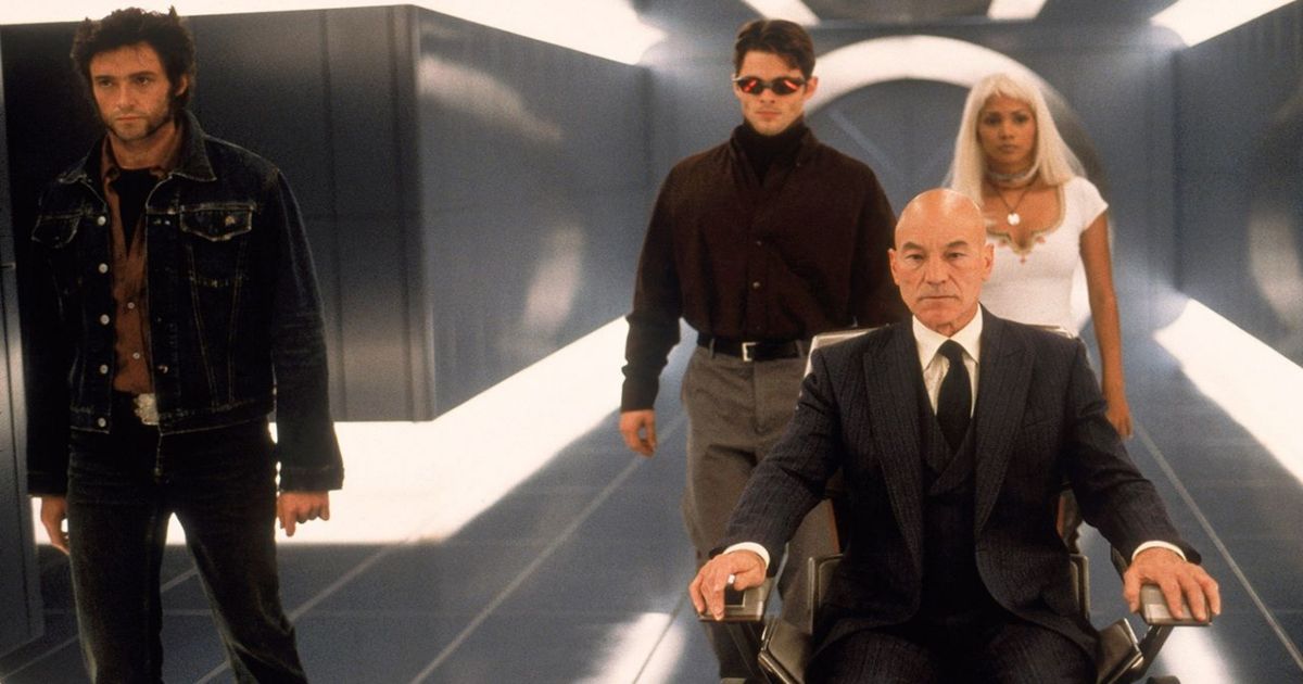 Xavier leads three X-Men down a hallway in the first movie