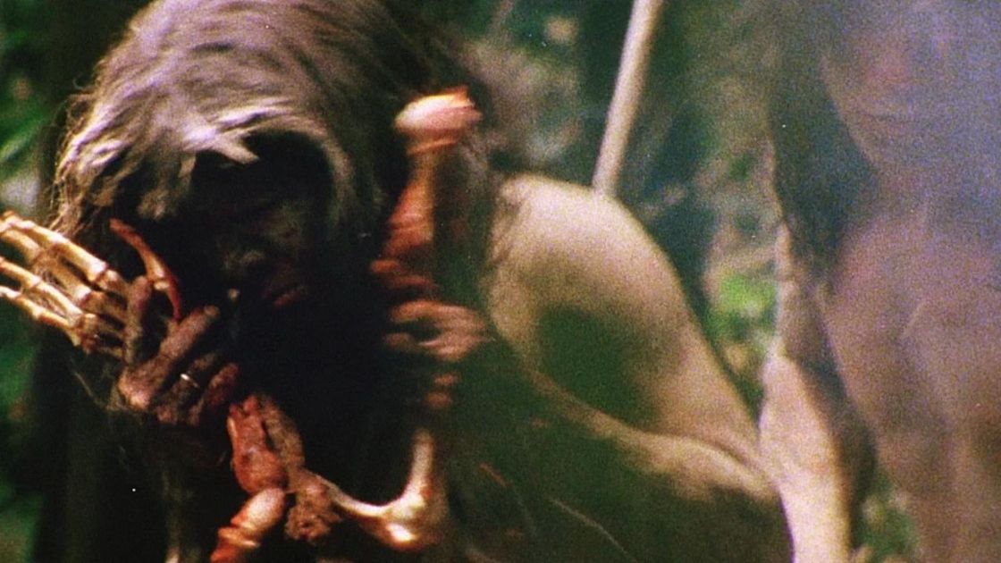 Native eating arm in cannibal holocaust. 