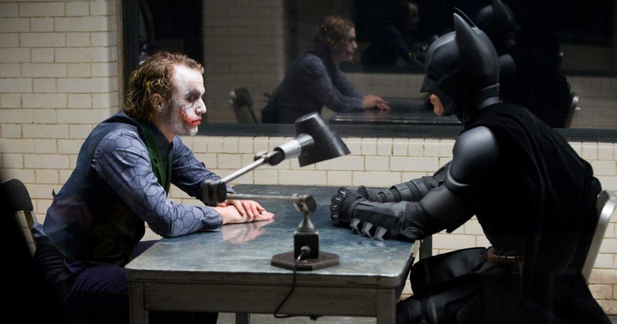 Joker and Batman across each other in The Dark Knight