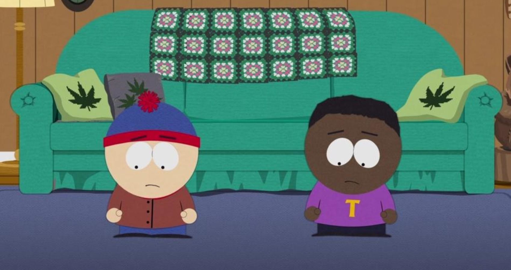 south park stan and token standing in front of a couch 