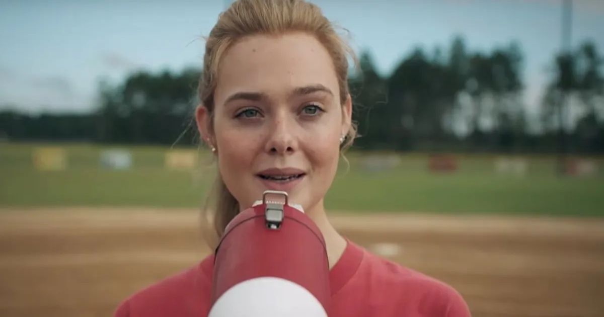 Girl stands on baseball field with microphone