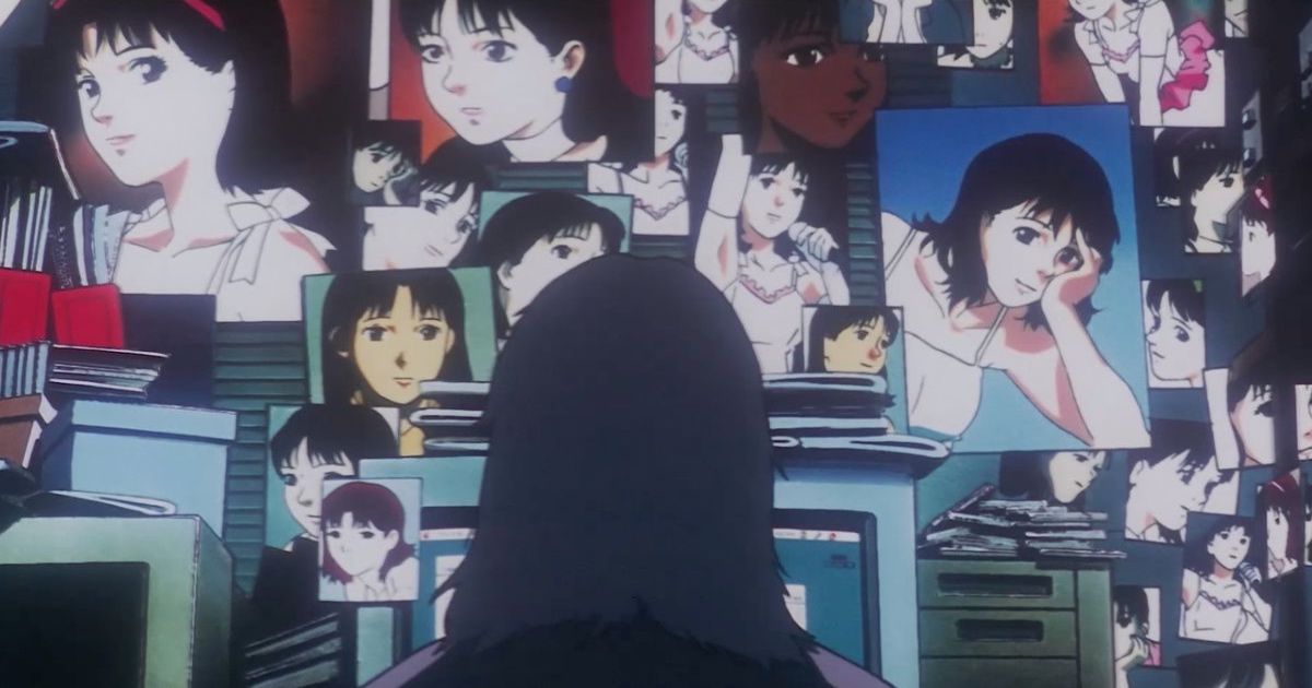 A woman watches screens of her own face in Perfect Blue