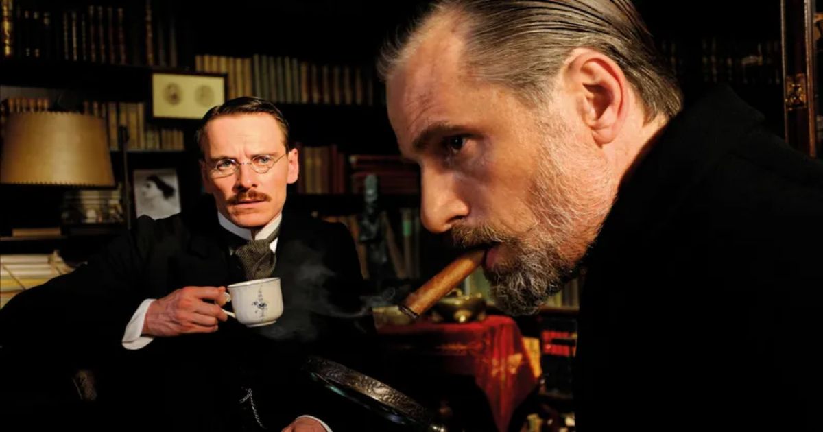 Mortensen smokes a cigar as Freud and Fassbender drinks coffee as Jung in A Dangerous Method