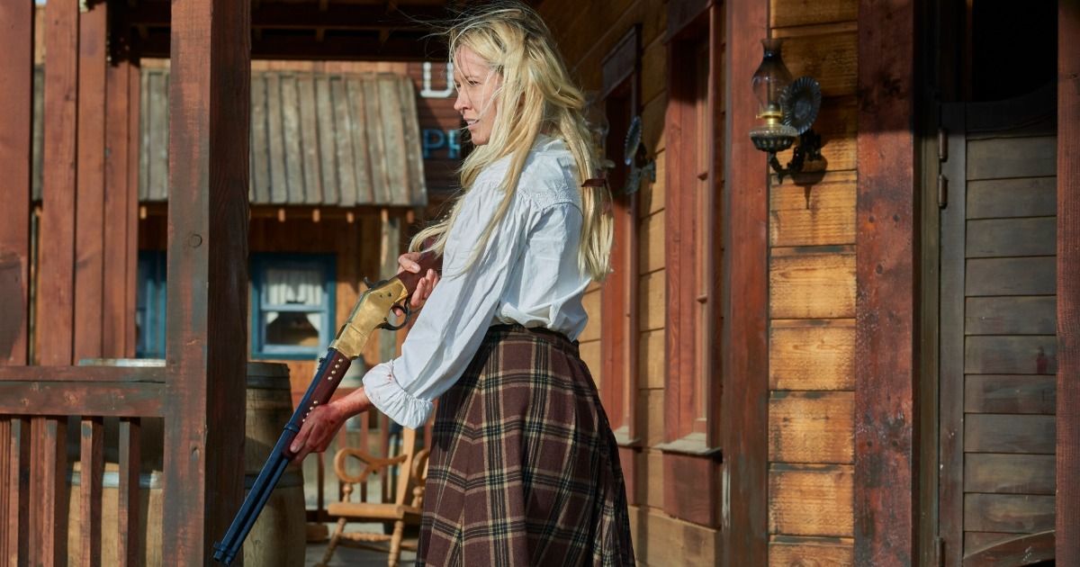 Anna Camp with a gun in Murder at Yellowstone City