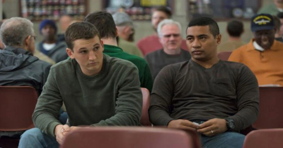 Beulah Koale sits next to Miles Teller in Thank You For Your Service