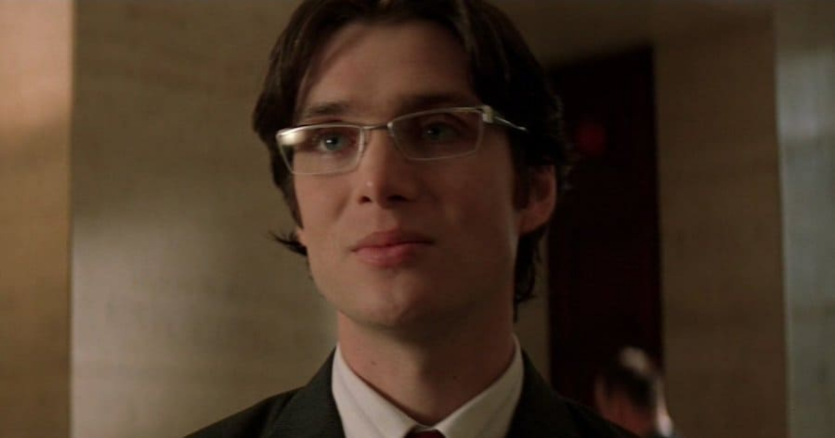 Cillian Murphy wearing glasses and a suit as Dr. Crane, or Scarecrow, in Batman Begins