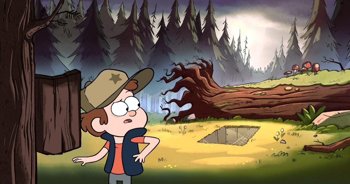 Dipper looks behind him at a secret trap door by a fallen tree in Gravity Falls