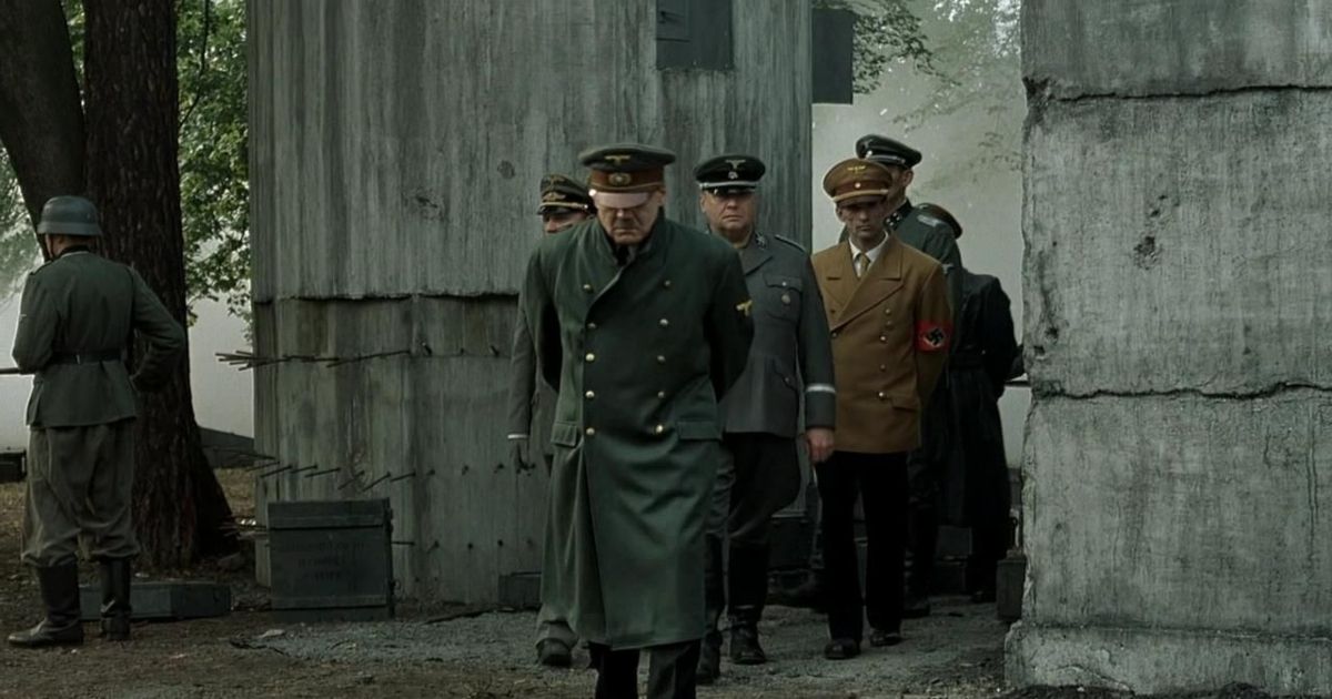 Nazi soldiers and Hitler walk into a courtyard in Downfall
